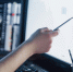 analyzing-data-close-up-young-businessman-pointing-data-presented-chart-with-pen-while-working-creative-office - Новый Компаньон