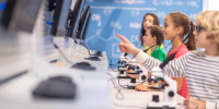 children-standing-sideways-camera-looking-charge-boards - Новый Компаньон