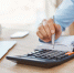 close_up_detail_professional_serious_accountant_sitting_light_office - Новый Компаньон